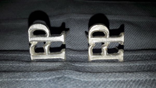 Schulterklappenauflage " FP " in silber