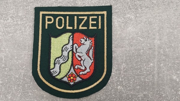 Polizei Nordrhein-Westfalen Armabzeichen grün maschinengestickt