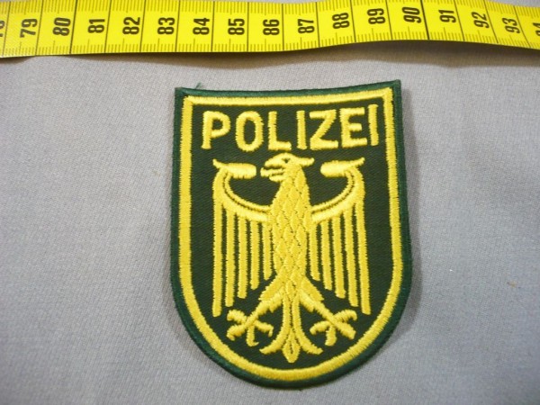 BUND: Armabzeichen, Bundespolizei: Bundesadler mit der Aufschrift "POLIZEI"